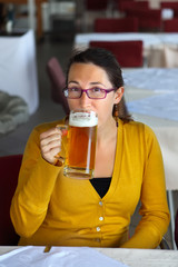 Young  woman drinking beer