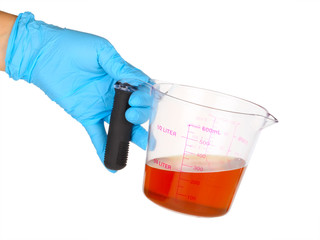 Gloved hand hold a flask