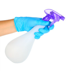 hand in glove holding spray bottle