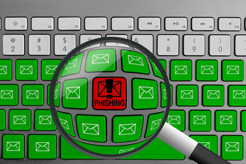 Computer keyboard with red phishing button surrounded with green email buttons and magnifying glass