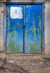 old weathered blue door in russia close up