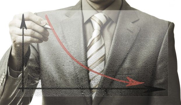 business concept. businessman drawing a graph down - Powered by Adobe