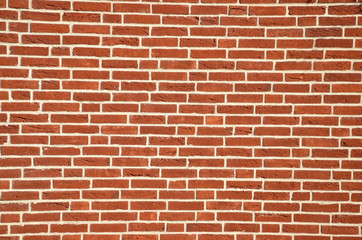 Fototapeta na wymiar Wall made from red bricks as an background