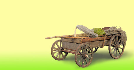 Fototapeta premium Rural cart for the horse on a yellow background.