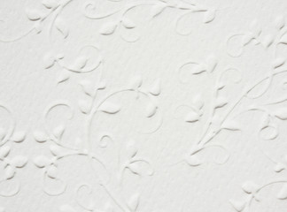 textural white background with a floral pattern