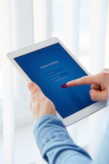 Male hands touching on a tablet