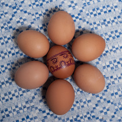 Colorful eggs on blue white towel