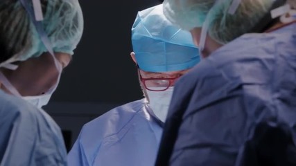 Portrait shot of medical staff performing operation in hospital setting