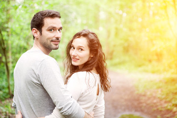 Obraz premium Portrait of a young happy couple in the nature