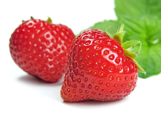 Strawberries and mint leave, isolated on white.