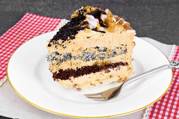 Sweets: Delicious fresh piece of cake with nuts. 