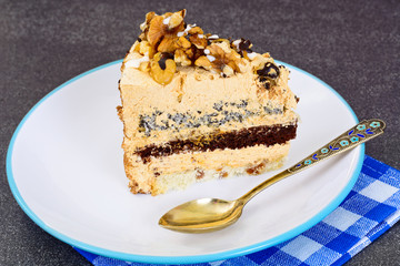 Sweets: Delicious fresh piece of cake with nuts. 