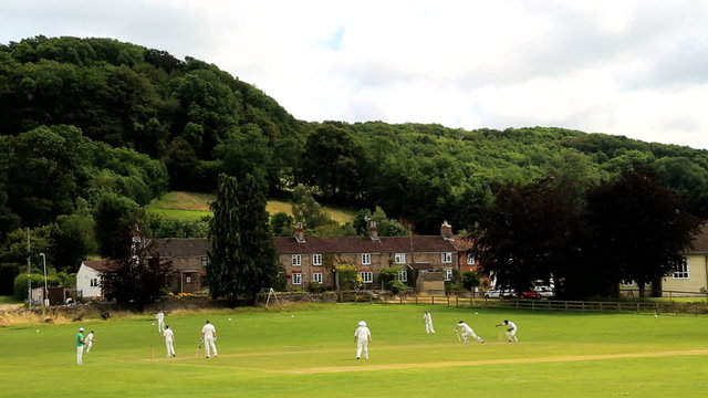 Cricket on the Village Green in the Cotswolds, Stinchcombe, England, UK