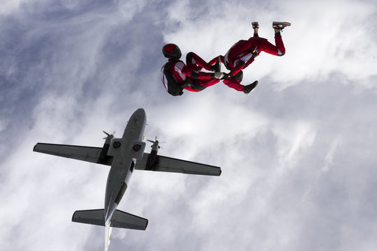 Two parachutists jumped from a plane.