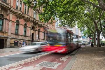 Fototapeten Blurred red bus in sydney © Anton Gorlin