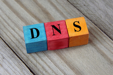 DNS (Domain Name System) acronym on colorful wooden cubes - obrazy, fototapety, plakaty