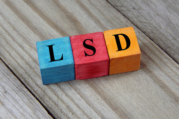 LSD (Lysergic Acid Diethylamide) acronym on colorful wooden cube