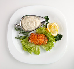 meat  with sauce on a white plate