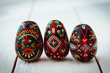 Beautiful Easter egg in hand schedule on the white boards