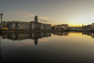 Fototapeta premium Cork city river reflection sunset cityscape