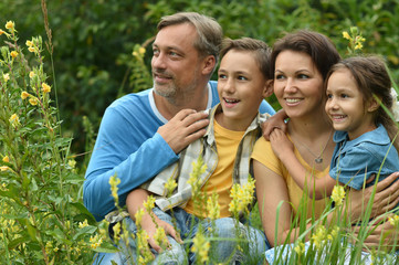 Fototapeta premium happy family at blooming field