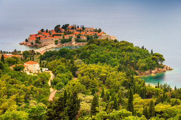 Fototapeta na wymiar View of the peninsula of Sveti Stefan from the height of the mountains.