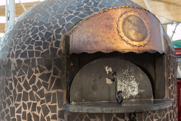 Closed Wood-burning Oven with Copper Sign