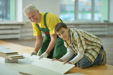 man and grandson repairing in the room