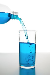 Pour cold water into glass