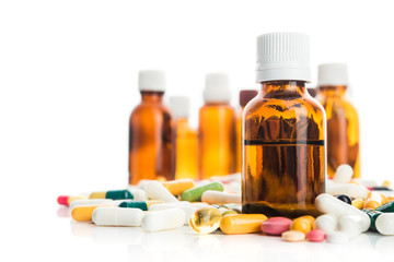 Pills and vitamin with bottle isolated