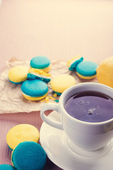 Coffee cup and sweet macaroons