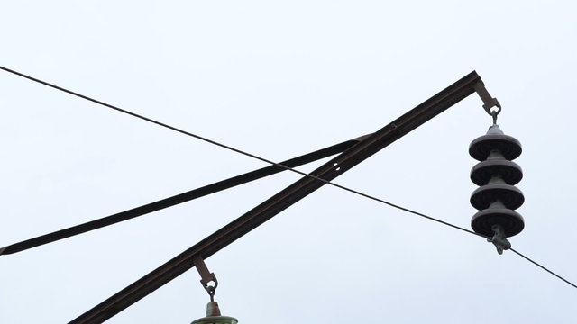 Closeup high-voltage network in the village. Slowly