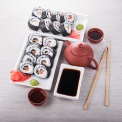 Sushi and roll with cream cheese and salmon fish inside