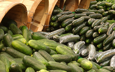 Cucumbers spilling from baskets
