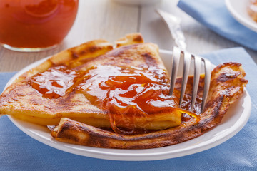 Homemade french crepes with orange syrup.