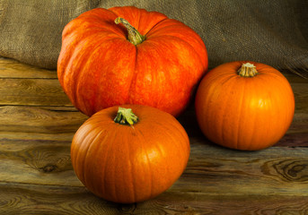 Pumpkins on dark wooden background
