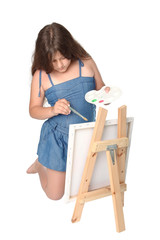 Girl painting a canvas