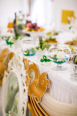 Elegant Wedding decorations with flowers and peacock feathers