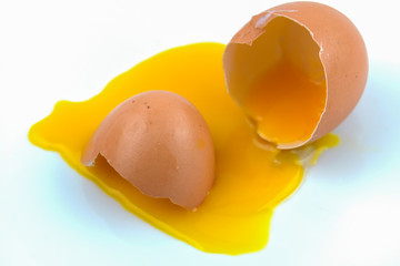 Broken chicken egg isolated on white background