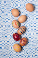 Colorful eggs on blue white towel