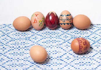 Colorful eggs on blue white towel