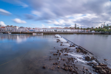 Fototapeta na wymiar Wide view of the picturesque city of Tavira, Portugal, crossed by Gilao river.
