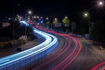 Fototapeta na wymiar View of car streak lights at night near the airport of Faro city, Portugal.