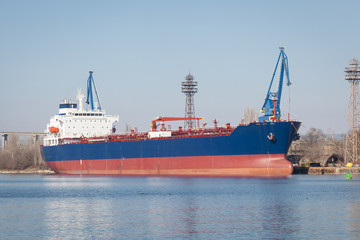 Fototapeta premium Large cargo ship in a dock at port