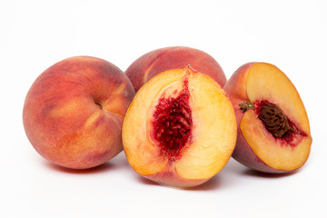 sweet peaches isolated on a white background.