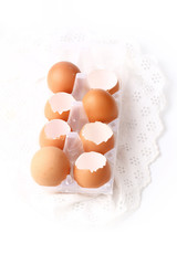 chicken eggs shells on white lace background