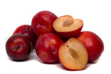 Tasty red plum fruits isolated on white background.