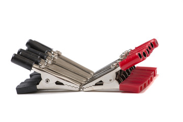 Alligator clippers on a white background.