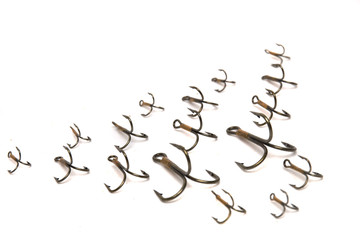 Treble fish hooks isolated on a white background.