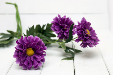 Fake purple flowers isolated on a white background.